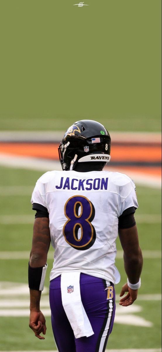 a football player wearing a helmet on the field