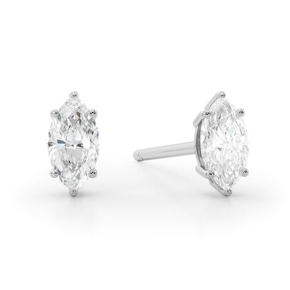 Show off your elegant taste in style when you wear these petite marquise-cut diamond solitaire stud earrings in white gold. Fashioned in 14K white gold Each earring showcases a 1/6 ct. marquise-cut diamond solitaire. Perfect for layering and stacking with other earring styles Radiant with 1/3 ct. t.w. of diamonds These post earrings secure comfortably with friction backs. Classic White Marquise Earrings, Classic Marquise Cut Brilliant Diamond Earrings, White Gold Marquise Cut Earrings For Formal Occasions, Classic Marquise Cut Diamond Earrings, White Marquise Diamond Earrings For Anniversary, Marquise Diamond Earrings In Sterling Silver, Marquise Sterling Silver Diamond Earrings, Classic White Gold Marquise Cut Diamond Earrings, Classic Marquise Cut Diamond Earrings For Anniversary