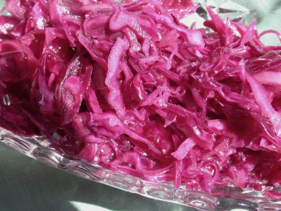 shredded red cabbage sitting on top of a table