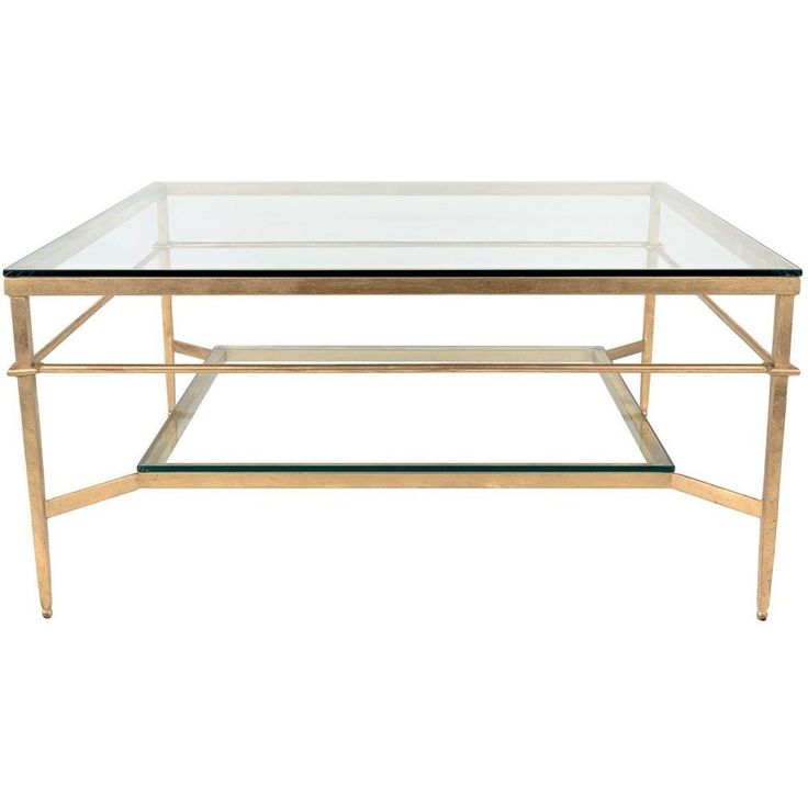 a glass and brass coffee table with two shelves on each side, against a white background