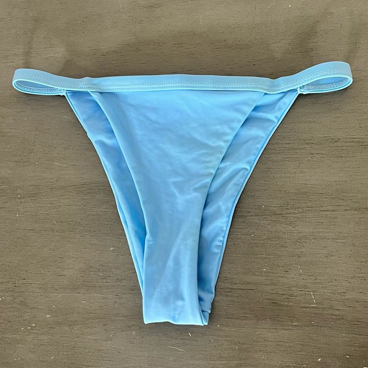 This Is A Pair Of Light Blue Ribbed High Cut Bikini Bottoms. - Small - High Cut - Swimsuit Lined - Never Worn But Tags Removed From A Smoke-Free, Pet-Free Home. Swimwear With Boning For Poolside, Solid Swimwear With Boning For Poolside, Solid Swimwear With Boning For Summer, Light Blue Bottoms For Poolside And Beach Season, Blue Tankini With Tie-side Bottom For Poolside, Blue Stretch Tankini Brief, Light Blue Tankini For Beach Party, Light Blue Beachwear Tankini For Pool, Blue Stretch Brief Tankini