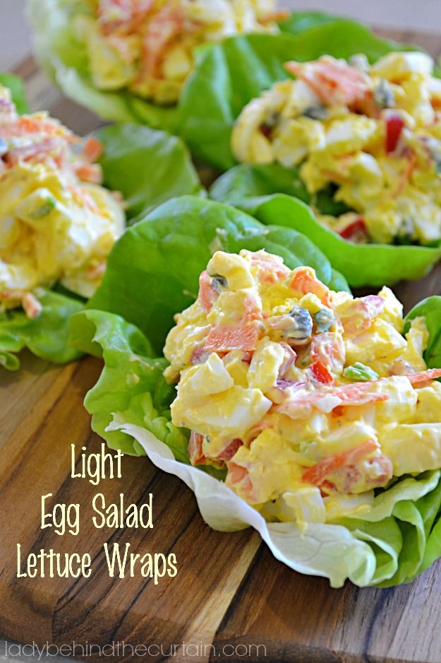 egg salad lettuce wraps on a cutting board with text overlay that reads light egg salad lettuce wraps