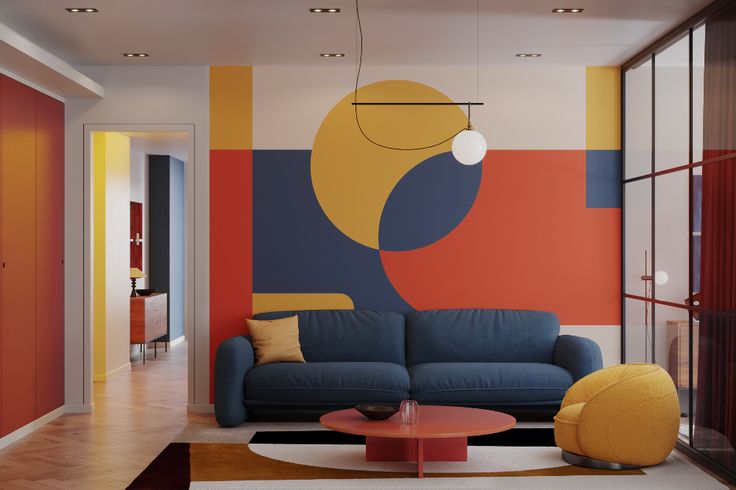 a living room filled with furniture next to a wall painted in different colors and shapes