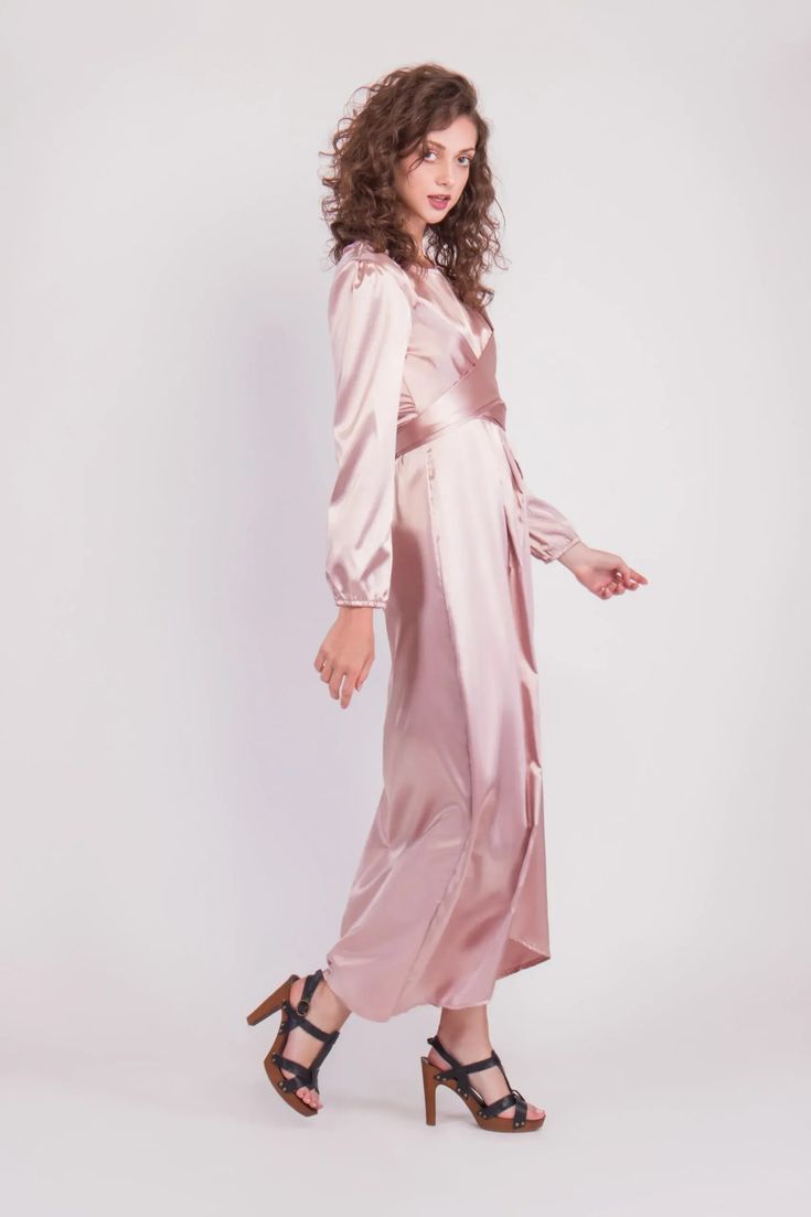 Feel more confident than ever before in the Satin Wrap Maxi Dress with Puff Sleeves that combines modesty with today’s most current modest fashion trends. The sleek satin maxi dress accentuates the waist with a luxurious wrap design while the puff sleeves accent a bold shoulder and feminine shape.Perfect for every special occasion, the unique dress comes in multiple colors to best fit your individual personality. Fitted Belted Maxi Dress For Brunch, Satin Belted Midi Dress For Party, Formal Maxi Dress With Belt, Floor-length Belted Party Dress, Belted Floor-length Party Dress, Party Satin Midi Dress With Belt, Belted Floor-length Maxi Dress, Elegant Pink Belted Maxi Dress, Chic Pink Belted Maxi Dress