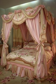 a pink canopy bed sitting in a bedroom