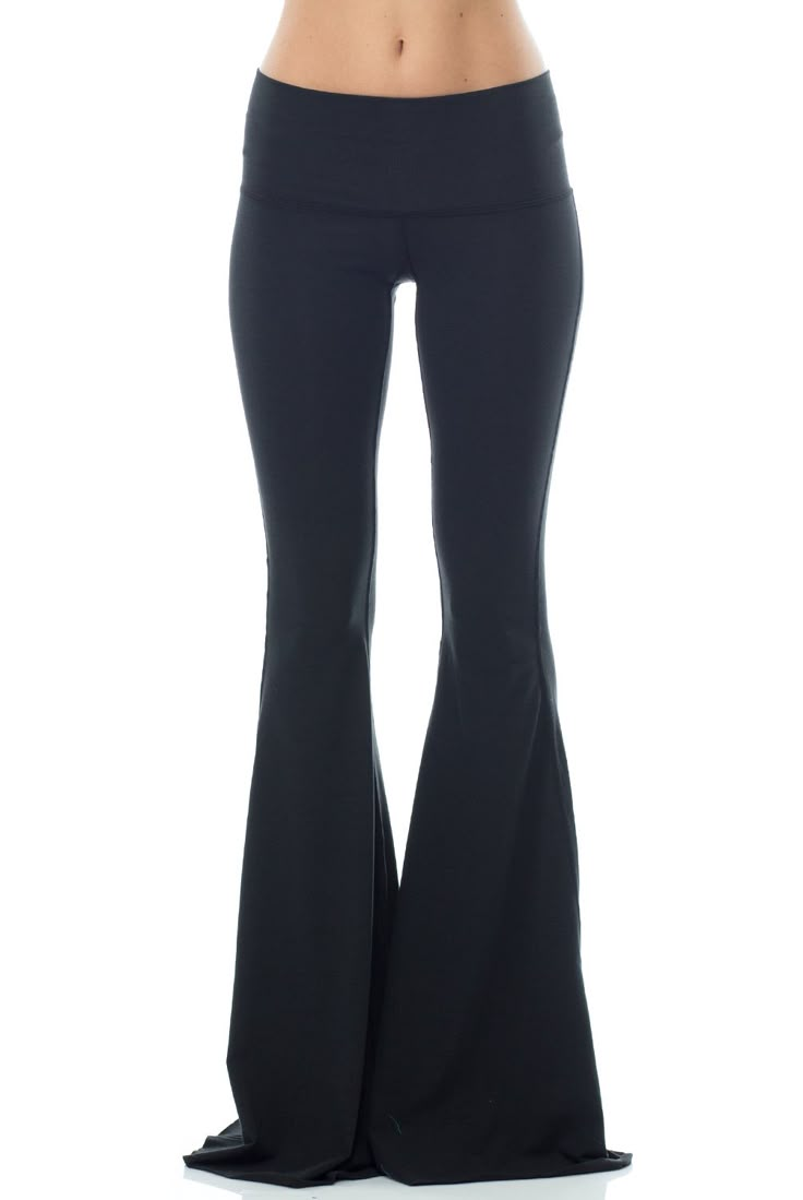 With a classic hue the Teeki Solid Black Bell Bottom will be your new go-to. This Teeki bell bottom offers an all new length 3 inches longer than the original style, allowing you to cut them to your perfect length! A chic Black hue makes the Teeki Bell Bottoms easy to wear and easy to pair with practically anything! Made of a soft recycled water bottle fabric, with breathability, and 4-way stretch, this pant ensures freedom of movement with minimal impact on the earth. With a Black Flare Bottoms For Loungewear, Black Flare Loungewear Pants, Flared Spring Activewear, Spring Flare Stretch Activewear, Spring Stretch Flare Activewear, Stretch Flare Activewear For Spring, Black Stretch Flares Casual Style, Casual Stretch Elastane Flares, Black Full Length Flares For Spring