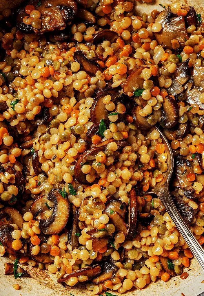 a bowl filled with cooked vegetables and grains