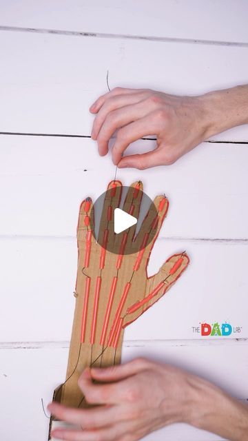 two hands that are holding something in the shape of a hand