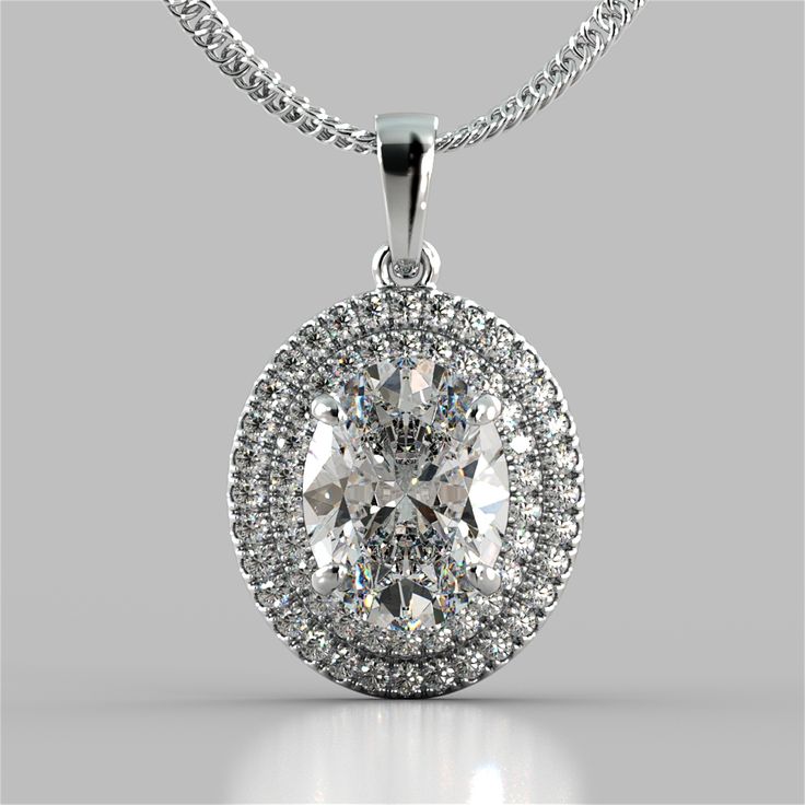 Show off your love with this lavish pendant. Featuring an exquisite Oval Style simulated diamond that is further detailed by a pave style halo. This pendant is further complimented by a glimmering bail slide that always sits flush on your décolleté. This lush piece is perfect for a lover of the finer things. Oval Cut Prong Set Double Tier Halo Pendant Center Stone: 3 CT Total Carat Weight: 3.45 CTW Stone Clarity: VVS-1 Available in: 925 Sterling Silver  16" 925 Sterling Silver  Chain Included Model: PD2505-WH-SL Emerald Cut Halo, Halo Earrings, White Gold Chains, Halo Pendant, Free Earrings, 925 Sterling Silver Chain, Classic Beauty, Lab Created Diamonds, Cut And Color