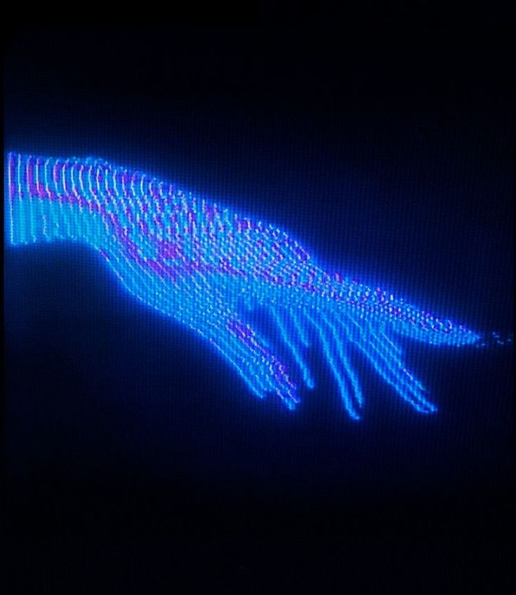 an image of a hand that is projected in the dark with blue and pink lights