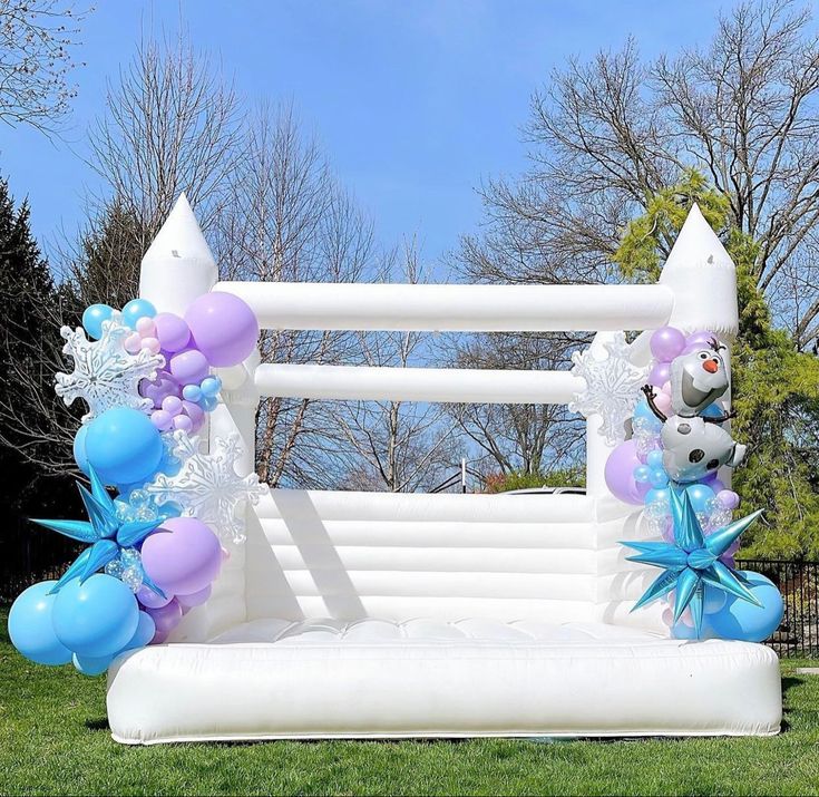 an inflatable balloon arch with balloons and animals