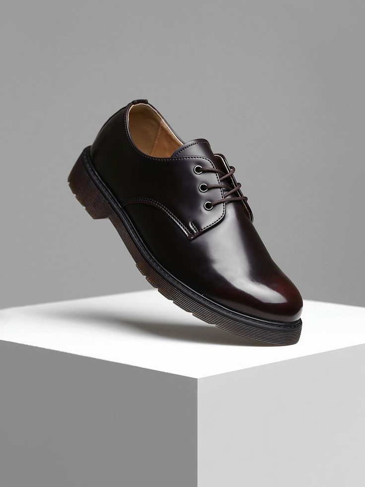 Editor's NotesPASCOROZEN’s derby shoes give a classic look with shiny leather fabric and lace-up design.- Comfortable fit- Lace-up design- Round toe style- Logo engraved in insole- Classic, minimal design- Shiny leather fabricMeasurements(in.)- Size: KR250mm(US7) - KR280mm(US10)- Heel Height: 1.4in.- Fits true to the size*Model Info: 5’10’’ 145.5lbs KR270mm(US9)Composition & Care- (Upper) Synthetic Leather (Lining) Synthetic Fiber (Heel) Synthetic Rubber- Please check the care labelDesigner- Modern Lace-up Leather Shoes For Derby, Modern Business Casual Lace-up Shoes With Round Toe, Office Low-top Dress Shoes With Brogue Detailing, Modern Brogue Lace-up Oxfords, Classic Low-top Patent Leather Shoes, Patent Leather Lace-up Oxfords With Rubber Sole, Modern Lace-up Oxfords With Brogue Detailing, Modern Lace-up Oxfords With Leather Sole, Office Low-top Lace-up Shoes With Contrast Sole