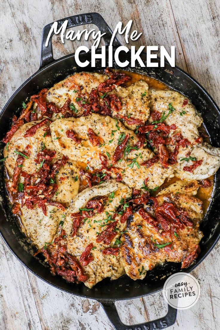 a skillet filled with chicken covered in sauce