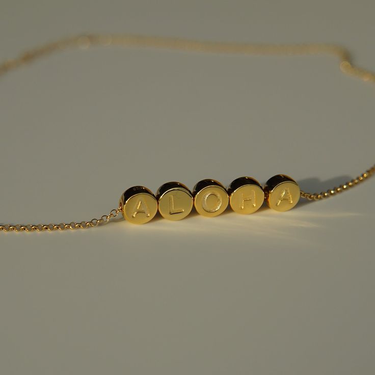 ALOHA individual beads on a dainty gold filled chain Available in an adjustable lengths 14kt gold filled chain, with vermeil pendants (sterling silver core with thick gold plating) Pendants approximately 1/4" height x 1/4" width Gold Charm Necklaces With Adjustable Length, Gold Charm Necklace With Adjustable Length, Adjustable Yellow Gold Charm Necklaces For Everyday, Minimalist Adjustable Gold Name Necklace, Adjustable 14k Gold Box Chain Necklace, Yellow Gold Plated Necklace With Adjustable Length, Adjustable 14k Gold Charm Necklace, 14k Gold Adjustable Chain Charm Necklace, 14k Gold Charm Necklace With Adjustable Chain