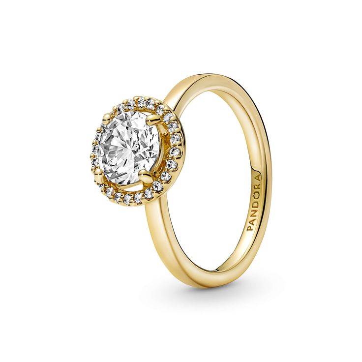 Classic yet modern, the 14k gold-plated Sparkling Round Halo Ring features a round center stone encircled by a halo of brilliant-cut clear cubic zirconia pavé. The Pandora logo is engraved on the inside of the shank. A timeless gift for an elegant Mom. Round Halo Ring, Pandora Logo, Round Halo, Pandora Rings, Timeless Gifts, Gold Plated Rings, Classic Ring, Fine Jewelry Gift, Halo Ring