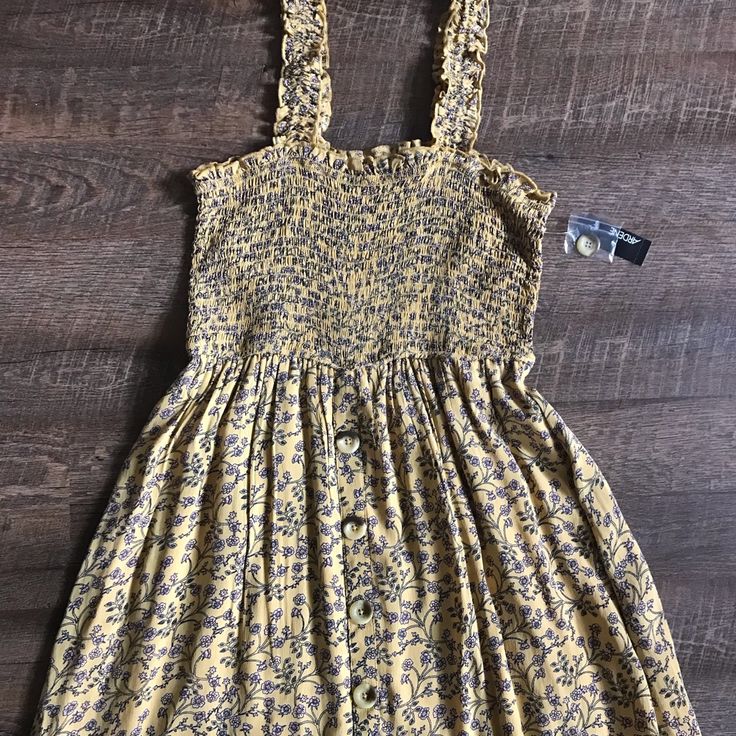 Brand New With Tags! Yellow With Pink Floral Print Sundress With Slip Underneath. Buttons Down Front. Casual Yellow Sundress For Summer, Casual Yellow Summer Dress, Cute Yellow Mini Dress For Vacation, Casual Mustard Mini Dress For Spring, Casual Mustard Dress For The Beach, Cute Yellow Floral Print Mini Dress, Cute Yellow Mini Dress With Floral Print, Mustard Sleeveless Casual Sundress, Yellow Fitted Sundress For Daytime