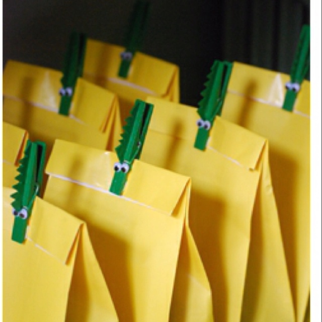 yellow bags with green handles are lined up