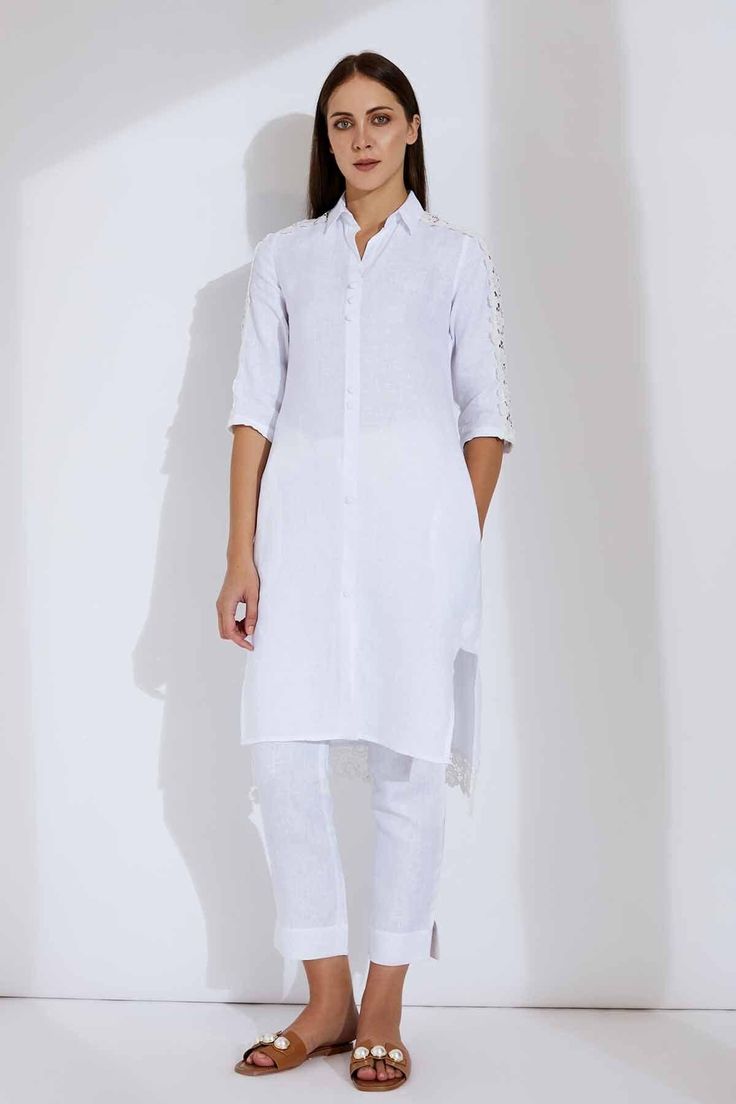 Super relaxed, soft as a feather, and incredibly glamorous - the Alora Linen kurta is an absolute dream and you'll look like one too when you step out wearing it! Made with linen/lace, it comes in white or maroon and features lace patches from shoulder to sleeve. The buttons are woven with crochet. The Alora LInen kurta radiates an ethereal appeal while ensuring you stay comfortable as ever! Model : Eduarda Height : 5Ft 8in  Wearing : XS Size Dress Fabric : 100% Linen Characteristics of Linen :  Hygroscopic All Natural UV Protection Kind On Skin Naturally Breathable Strong Improves With Age Handmade With Love In India By Yell Retail India. Price is Inclusive of All taxes. Luxury White Kurta For Summer, Cheap White Kurta For Festive Occasions, Luxury White Sleeveless Kurta, Luxury White Kurta For Spring, Luxury Off-white Kurta For Summer, Luxury White Summer Kurta, Luxury White Cotton Kurta, Cheap White Cotton Kurta, Spring Linen Kurta With Chikankari Embroidery