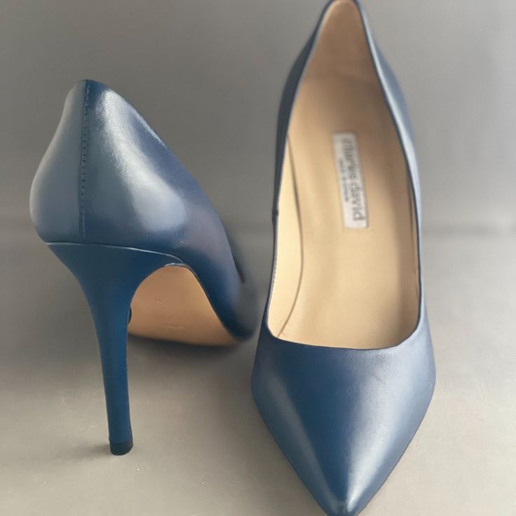 Charles David Dash Pump In Indigo. From Charles David's Most Lux Line Of Shoes. Made In Spain. Leather Upper, Lining, And Outsole. These Are A Super Classic High Heel Silhouette. Great Way To Add Color To Any Outfit. Blue Court Shoes With 4-inch Heel And Medium Width, Blue Court Shoes With Medium Width And Round Toe, Blue Slip-on Office Heels, Blue Slip-on Heels For Work, Blue Slip-on Heels For Office, Fitted Blue Heels With Removable Insole, Blue Fitted Court Shoes With Padded Heel, Fitted Blue Court Shoes With Padded Heel, Blue Almond Toe Court Shoes