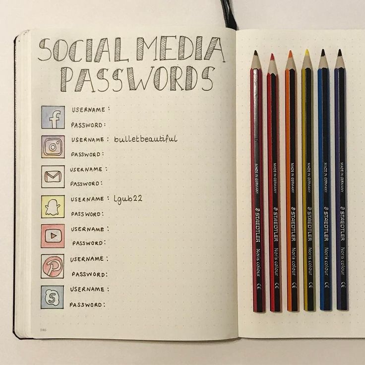 an open notebook with several pencils next to it and the words social media passwords