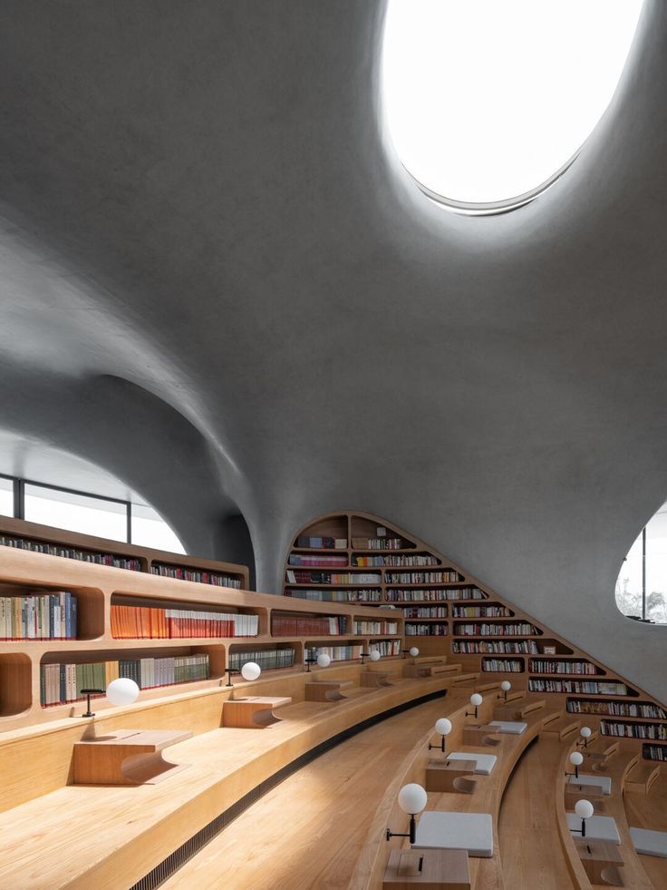 the interior of a library with many bookshelves