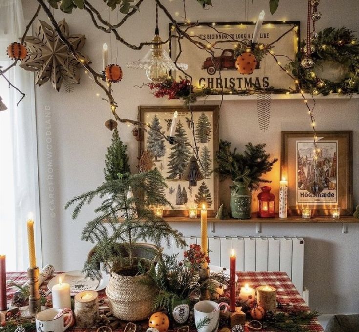 a dining room table with candles and christmas decorations