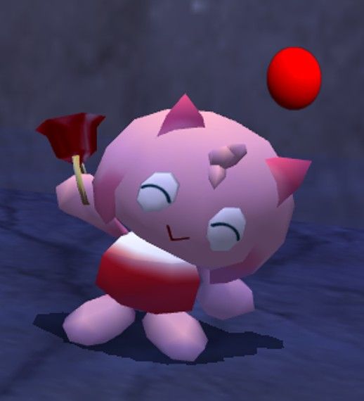 a pink cat is throwing a red ball into the air with it's paws