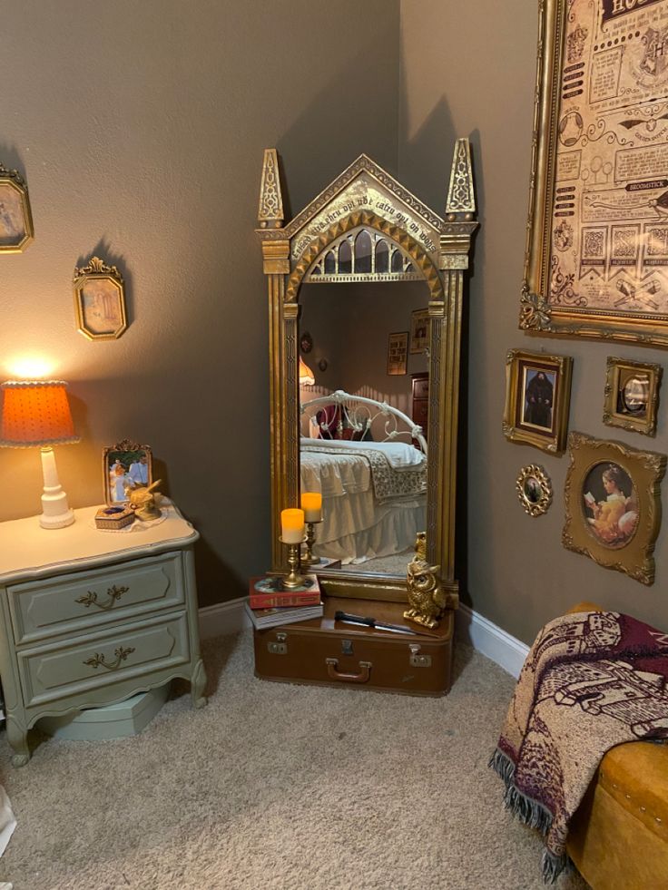 a bedroom scene with focus on the dresser and mirror, which has been decorated in gold