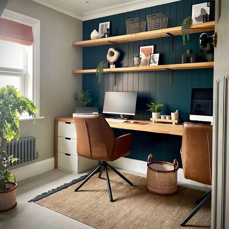 a home office with wooden shelves and leather chairs in front of the desk, along with a potted plant