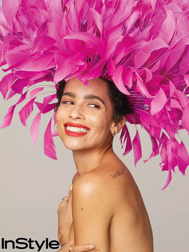 the cover of instyle magazine features a woman with bright pink feathers on her head