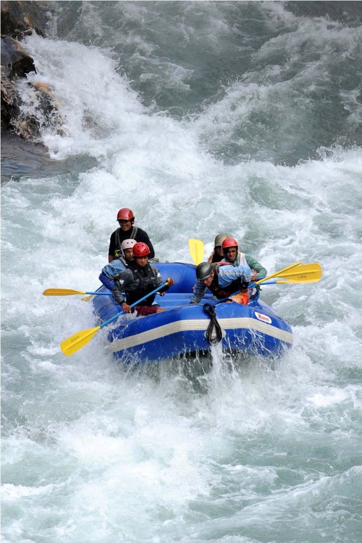 three people are rafting down the rapids on their rafts in the water,