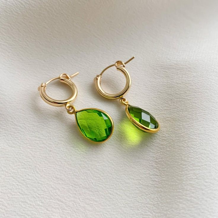 Simple and sweet, these hoop earrings feature small pear-shaped gemstone charms that are faceted on both sides. We've got gemstones for every month of the year. -- charms: 18mm 14k Gold Filled hoop diameter: 13mm secure latch back closure bezel frame: 22k gold plated sterling silver available gemstones: 12 hydrothermal quartz stones Note: moonstone - natural gemstone Faceted Briolette Teardrop Earrings, Everyday Teardrop Huggie Earrings, Gold Faceted Teardrop Hoop Earrings, Gold Teardrop Hoop Earrings With Birthstone, Faceted Drop Teardrop Earrings For Gift, Gold Teardrop Earrings With Charms, Teardrop Earrings For Everyday - May Birthstone, Yellow Gold Teardrop Earrings With Charms, Everyday Teardrop Earrings For May Birthstone