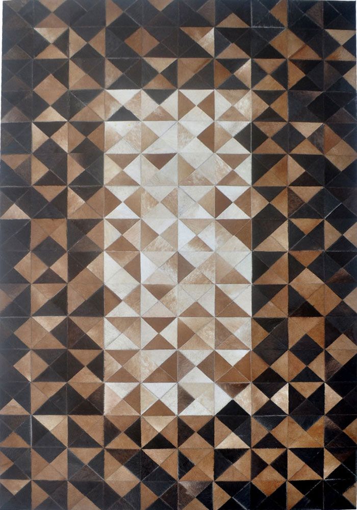 a brown and black area rug with an abstract design