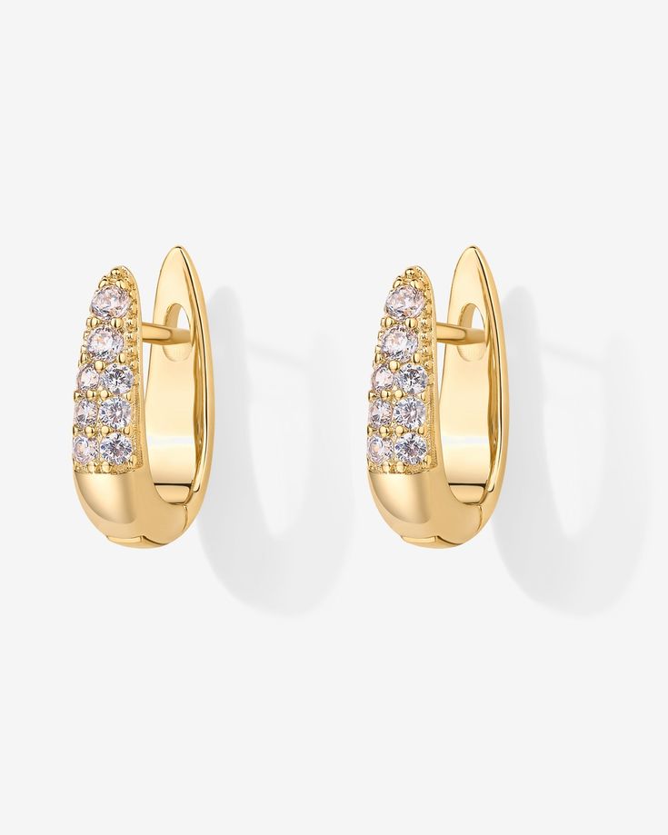 Elevate your style effortlessly with these chic earrings! Featuring stunning AAAAA cubic zirconia stones that catch the light just right, they add a touch of glam to any look, day or night. Materials: 925 sterling silver posts 18K Yellow Gold or Rhodium plated Measurements: Length: 16mm; Width: 4.5mm. Hypoallergenic, nickel free, and lead-free. Elegant Huggie Earrings With Sparkling Stones For Wedding, Formal Huggie Earrings With Sparkling Stones, Yellow Gold Earrings With Sparkling Cubic Zirconia Stones, Formal Sparkling Stone Huggie Earrings, Cubic Zirconia Huggie Earrings For Party, Classic Huggie Earrings With Cubic Zirconia, Classic Cubic Zirconia Huggie Earrings For Pierced Ears, Chic Cubic Zirconia Earrings For Anniversary, Modern Earrings With Sparkling Stones For Anniversary