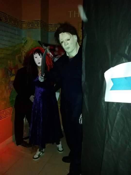 two people dressed up in costumes standing next to each other