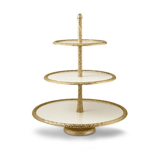 three tiered cake stand in gold and white