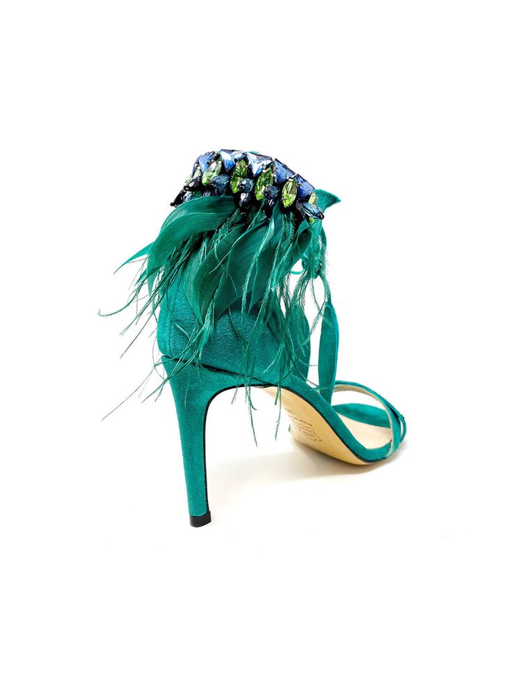 LIMITED EDITION Runs half size Large Details Color: Teal Heel height: 85 mm Heel / 3.35 inches Upper Material: Suede Suede Leaves detail and crystal-embellished Ostrich Feathers with Strass crystal rhinestones Round toe Beige leather insole Beige leather sole and rubber heel cap Padded insole makes these incredibly comfortable Country of Origin: Italy Description The “Maira“ stilettos, featuring delicately designed with feather and Strass crystal stones details adorning the Ankle lace-up, deliv Evening Sandals With Feather Trim And Ankle Strap, Feathered Open Toe Evening Sandals, Evening Open Toe Sandals With Feathers, Luxury Feather Trim Heels For Formal Occasions, Elegant Feather Trim Sandals For Summer, Elegant Summer Sandals With Feather Trim, Hand Embellished Heels For Party, Tennis Shoe Heels, Teal Heels