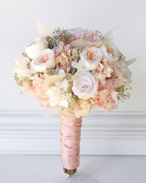 a bridal bouquet with pink and white flowers