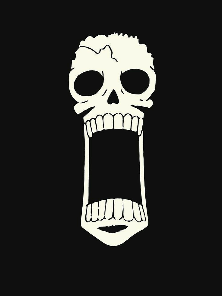 a white skull with its mouth open on a black background