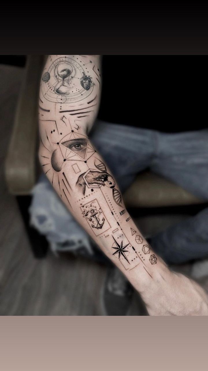 a man's arm with many different tattoos on it