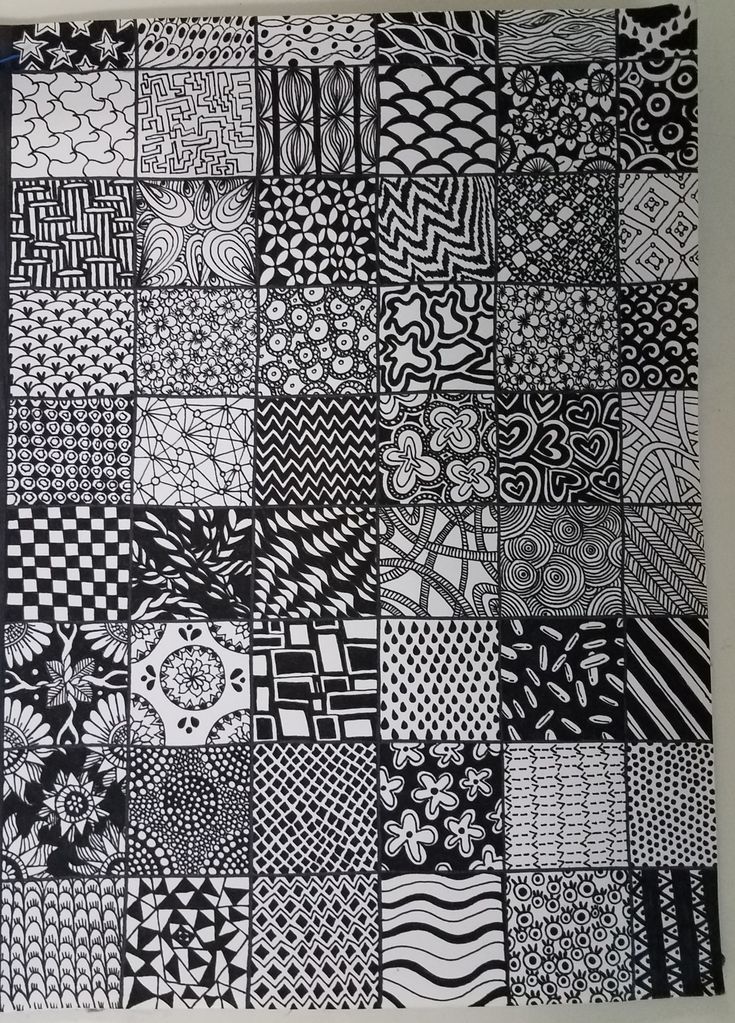 a black and white drawing of many different patterns on a piece of paper that has been drawn