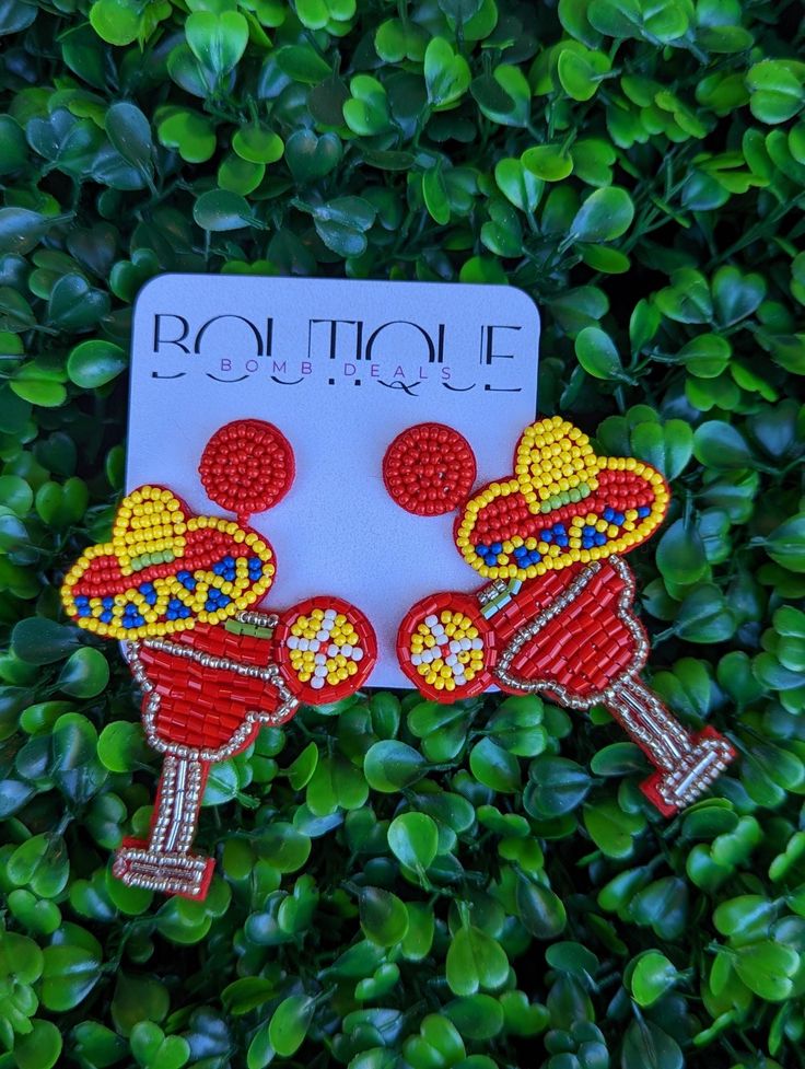 Sip a Margarita in style on Cinco de Mayo, Taco Tuesday or any night of the week! Beaded earrings featuring a Colorful Sombrero nested in a Margarita! Approximately 3" in length Custom Trucker Hats, Holiday Gift Card, Everyday Purse, Tassel Bracelet, Beaded Headband, Beaded Purses, Taco Tuesday, Beaded Keychains, Purse Strap