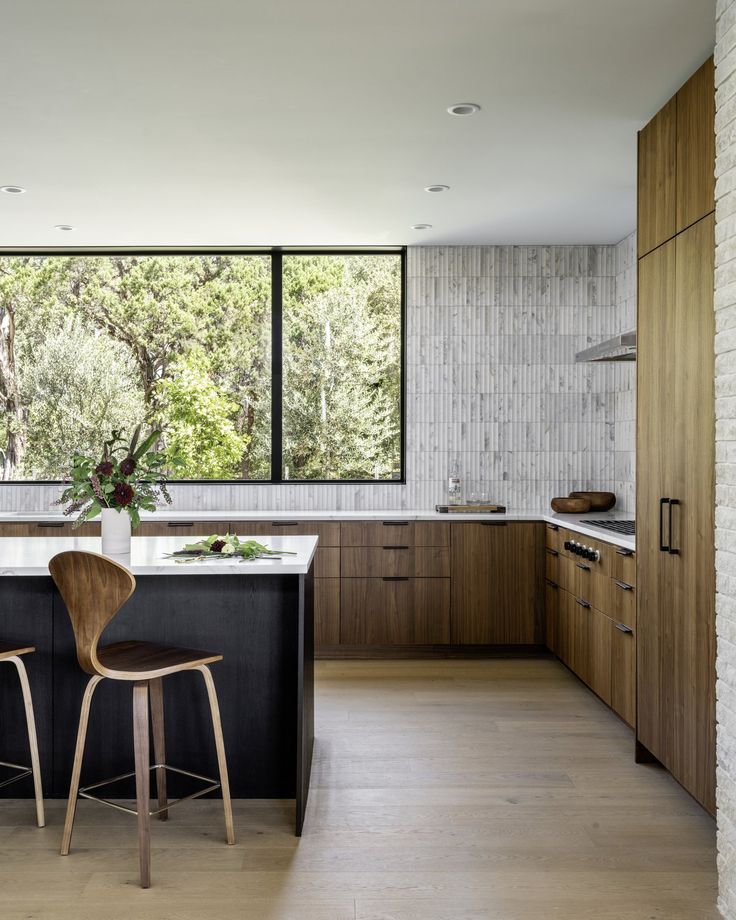 the kitchen is clean and ready to be used as a dining room or office space