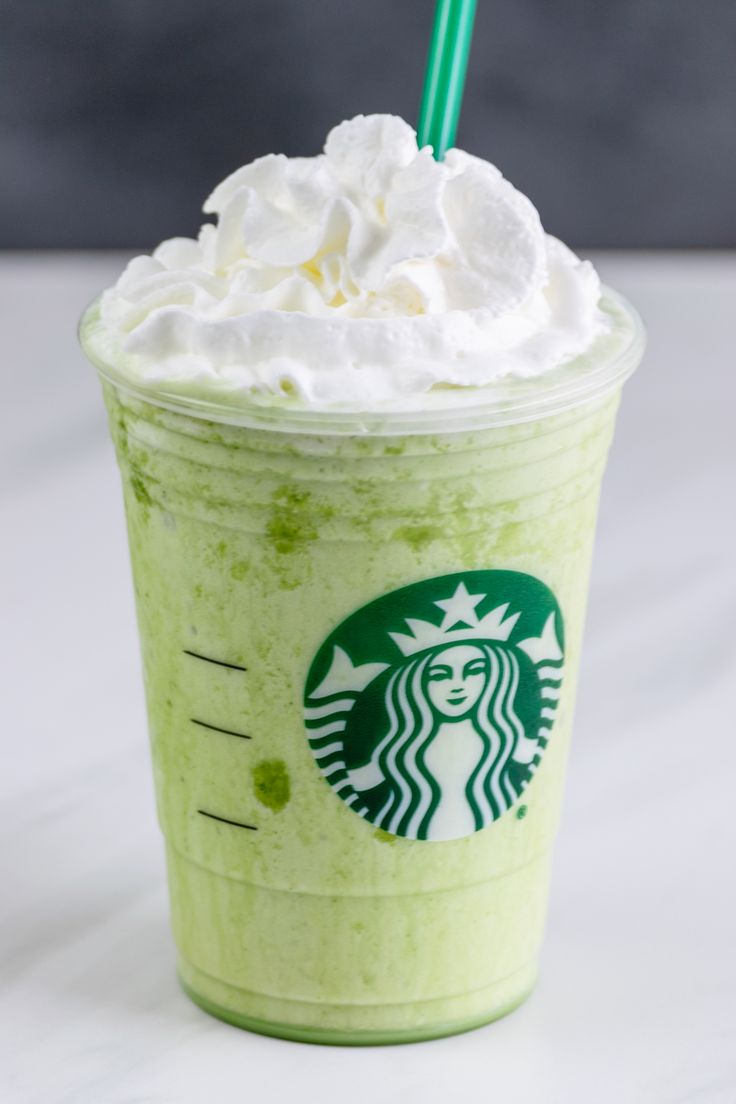 the starbucks green tea frappuccino is topped with whipped cream