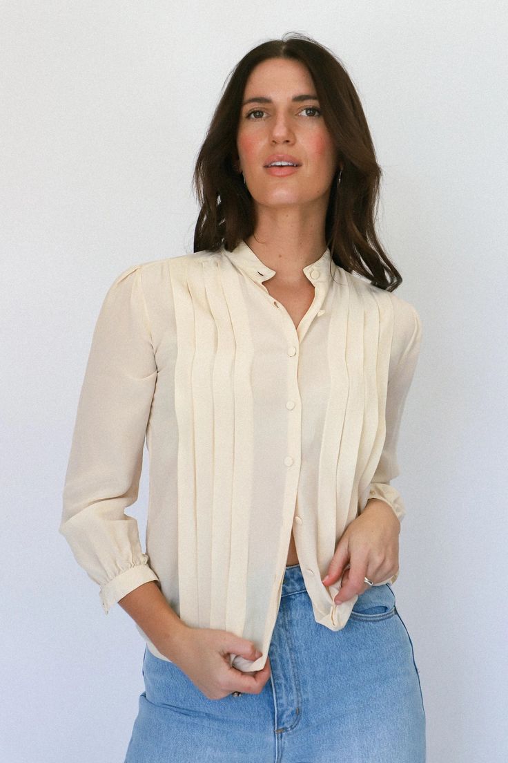 Ivory Pleated Blouse — Prism Boutique Vintage Cream Tops For Day Out, Vintage White Blouse For Day Out, Classic Beige Spring Blouse, Cream Long Sleeve Shirt For Day Out, Feminine Off White Tops For Fall, Cream Shirt For Spring Workwear, Cream Shirt For Fall Day Out, Cream Shirt For A Day Out In Fall, Cream Blouse For Daywear In Fall