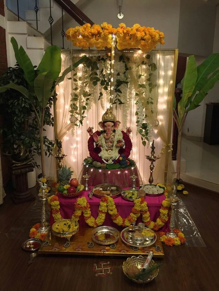 a shrine with flowers and candles around it