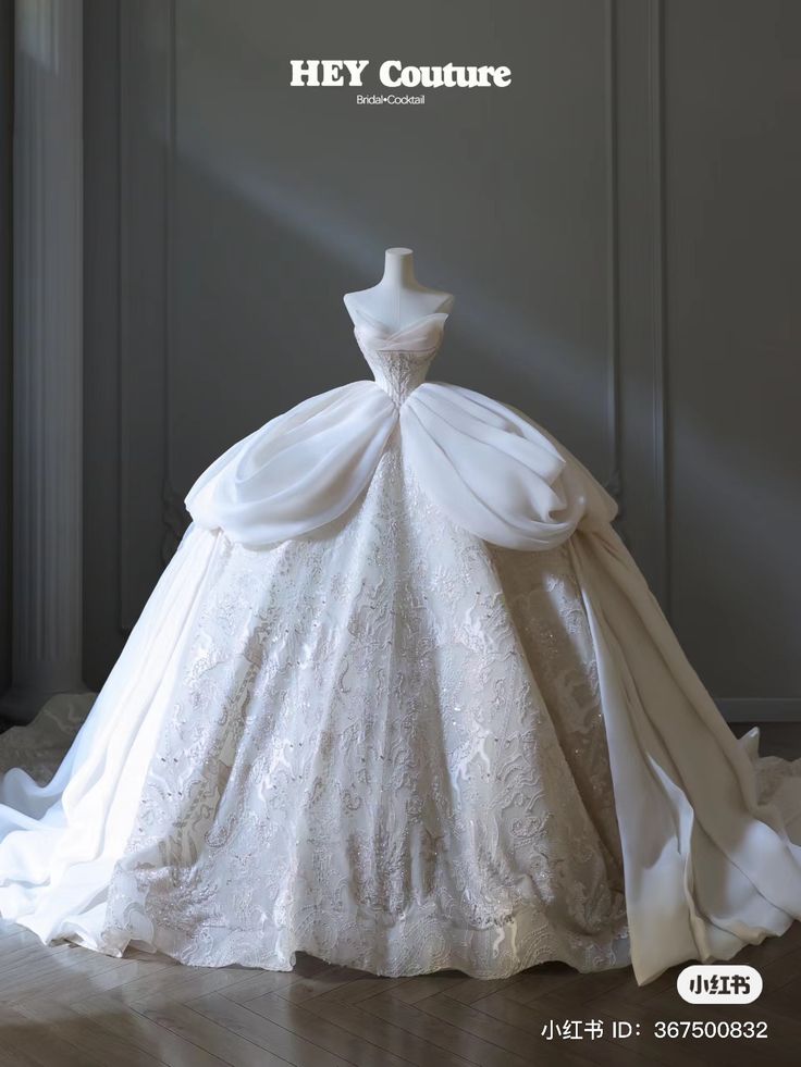 a white wedding dress on display with the words hey couture written above it