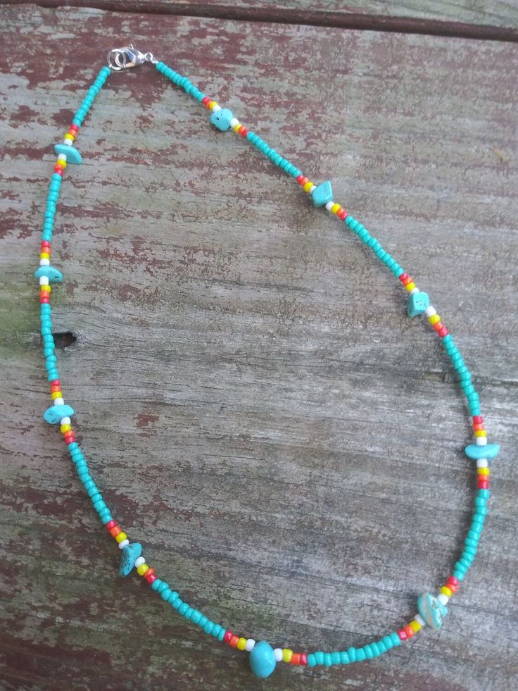 This necklace features turquoise stones and colorful western seed beads. Hand-strung Turquoise Necklace For Festivals, Festival Hand-strung Turquoise Necklace, Southwestern Turquoise Necklace For Beach, Southwestern Style Multicolor Beaded Necklaces For Beach, Western Blue Jewelry For The Beach, Multicolor Beaded Turquoise Necklace For Beach, Festival Turquoise Necklace With Tiny Beads, Southwestern Turquoise Beaded Necklaces For Beach, Turquoise Southwestern Beaded Necklace For Beach