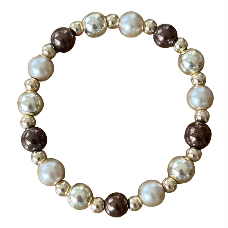 "The Rich Neutral Ainsley Bracelet is a must-have for any fashion-forward individual. Made with high-quality gold-filled material, it adds a touch of elegance to any outfit. Experience the beauty and sophistication of this unique piece, perfect for any occasion." HOC-Spring and Autumn Elegant Adjustable Brown Pearl Bracelet, Elegant Gold Stretch Bracelet For Formal Occasions, Elegant Stretch Bangle Bracelet Gift, Elegant Adjustable Beaded Gold Bracelet, Elegant Adjustable Gold Bracelet With Round Beads, Elegant Gold Bracelet With Adjustable Round Beads, Elegant Rose Gold Metal Beaded Bracelets, Everyday Elegant Brown Jewelry, Brown Elegant Everyday Jewelry