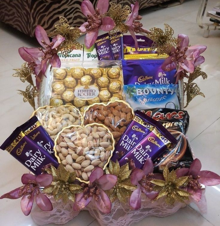 a basket filled with assorted chocolates and nuts